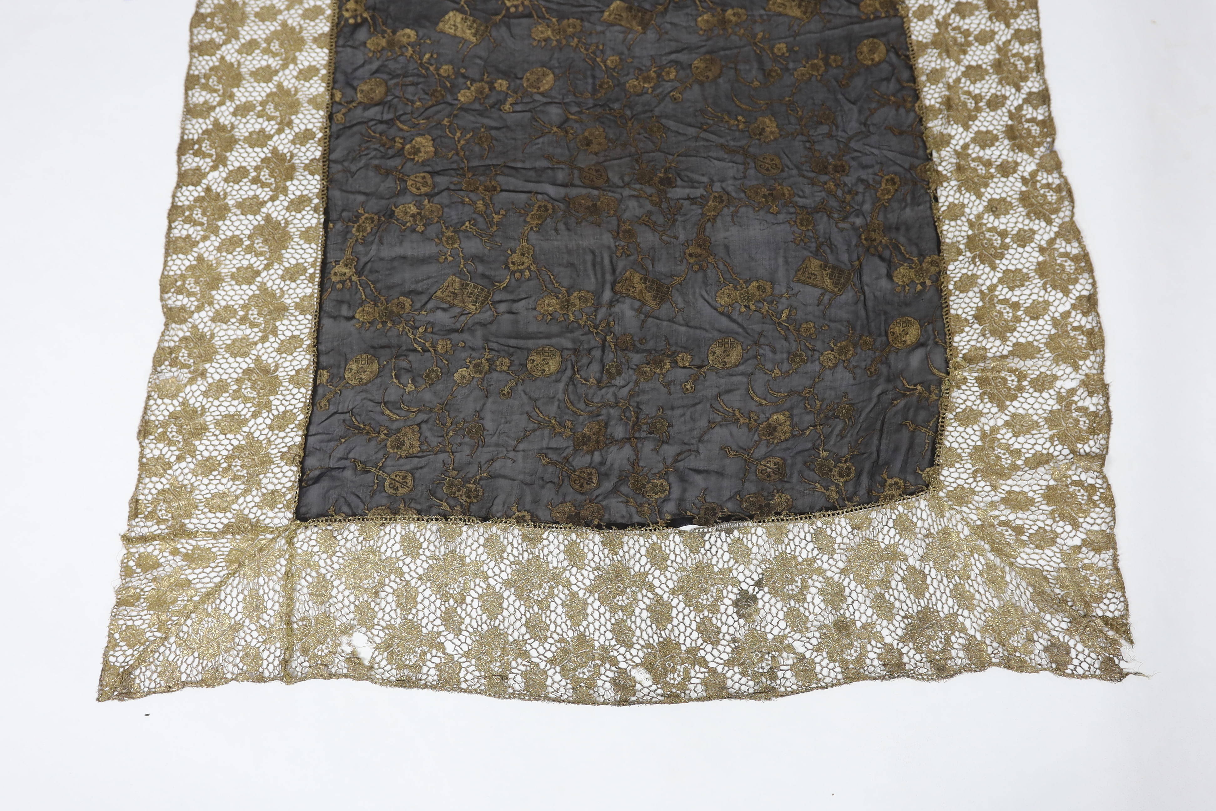 An unusual 1920's gold lace and black silk chiffon gold brocade boudoir cover, 140 x116cm
